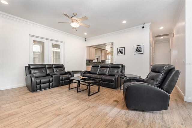 629 Orange Valley Ln, Lakeland, FL 33813 - living room featuring a ceiling fan, ornamental molding, light wood finished floors, baseboards, and recessed lighting