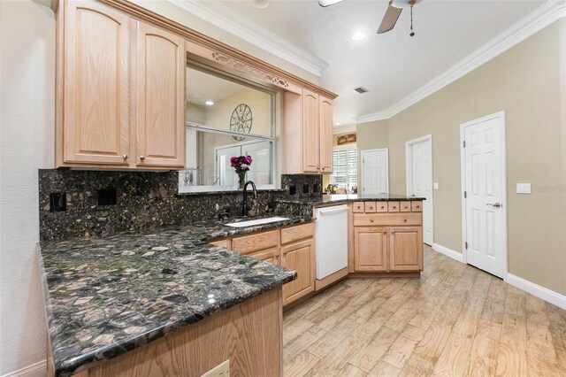 629 Orange Valley Ln, Lakeland, FL 33813 - kitchen featuring white dishwasher, a sink, light brown cabinets, crown molding, and a peninsula