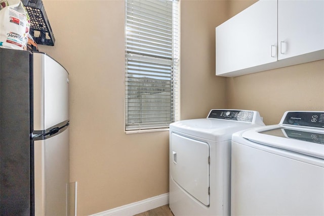 629 Orange Valley Ln, Lakeland, FL 33813 - laundry room with cabinet space, washing machine and dryer, and baseboards