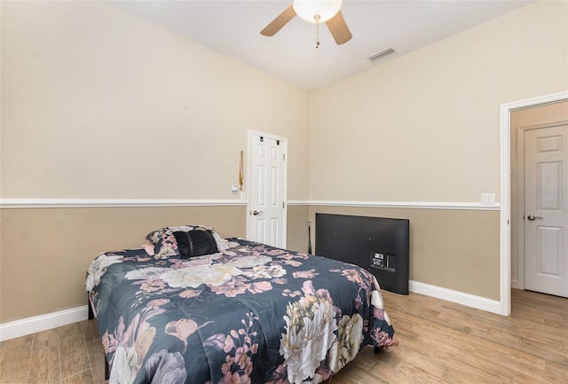 629 Orange Valley Ln, Lakeland, FL 33813 - bedroom with wood finished floors, baseboards, and a ceiling fan
