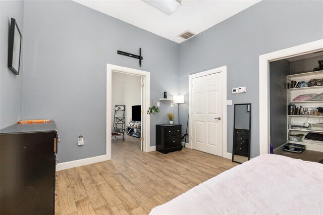 629 Orange Valley Ln, Lakeland, FL 33813 - bedroom with light wood-type flooring, baseboards, and a high ceiling
