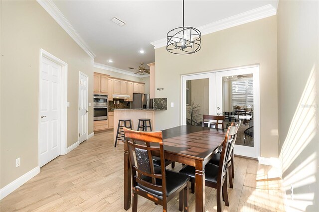 629 Orange Valley Ln, Lakeland, FL 33813 - dining area featuring ornamental molding, light wood finished floors, a chandelier, baseboards, and recessed lighting