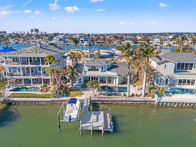 17077 Dolphin Dr, North Redington Beach, FL 33708 - aerial view of residential area with a pool and a large body of water