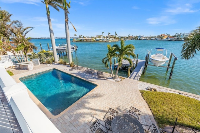 17077 Dolphin Dr, North Redington Beach, FL 33708 - outdoor pool featuring boat lift, a boat dock, a water view, and a patio