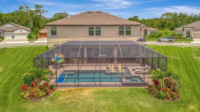 9136 Warm Springs Cir, Parrish, FL 34219 - rear view of house with stucco siding, a patio, a lawn, and a lanai