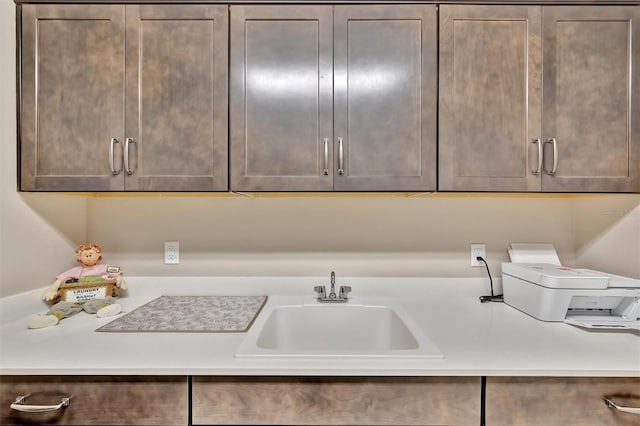9136 Warm Springs Cir, Parrish, FL 34219 - laundry room featuring cabinet space