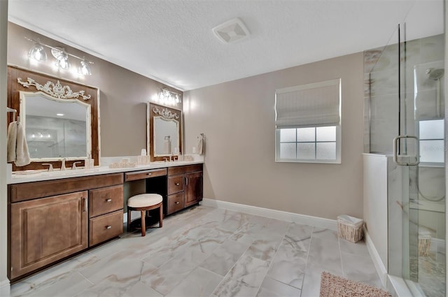 9136 Warm Springs Cir, Parrish, FL 34219 - full bath featuring double vanity, a stall shower, a textured ceiling, and marble finish flooring