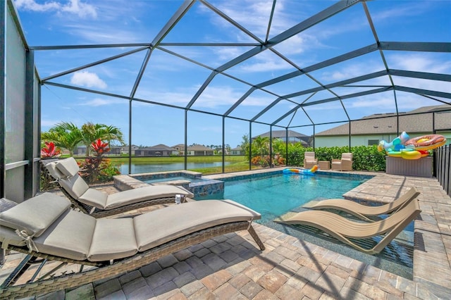 9136 Warm Springs Cir, Parrish, FL 34219 - view of pool with a water view, a pool with connected hot tub, a patio area, and glass enclosure