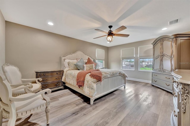 9136 Warm Springs Cir, Parrish, FL 34219 - bedroom with light wood-type flooring, ceiling fan, baseboards, and recessed lighting