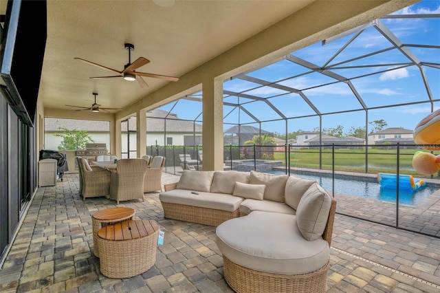 9136 Warm Springs Cir, Parrish, FL 34219 - view of patio featuring area for grilling, ceiling fan, glass enclosure, and a pool with connected hot tub