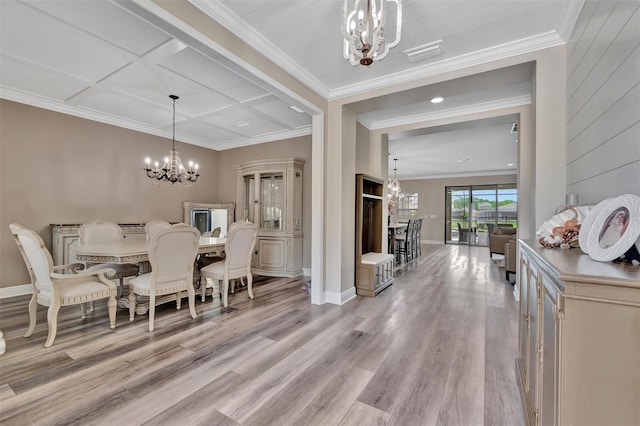 9136 Warm Springs Cir, Parrish, FL 34219 - dining room featuring a chandelier, light wood finished floors, crown molding, baseboards, and coffered ceiling