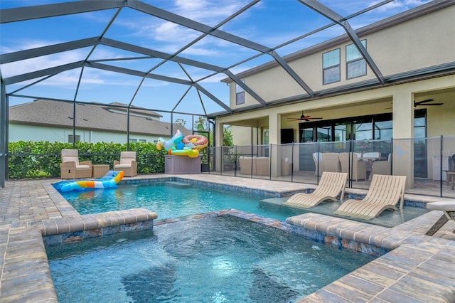 9136 Warm Springs Cir, Parrish, FL 34219 - view of swimming pool featuring a ceiling fan, a pool with connected hot tub, a patio, and exterior kitchen
