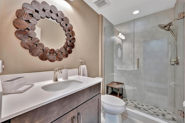 9136 Warm Springs Cir, Parrish, FL 34219 - bathroom with toilet, a stall shower, vanity, and recessed lighting