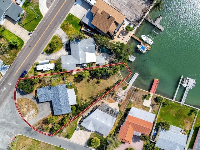 11465 7th St E, Treasure Island, FL 33706 - aerial view of property and surrounding area with property parcel outlined and a nearby body of water