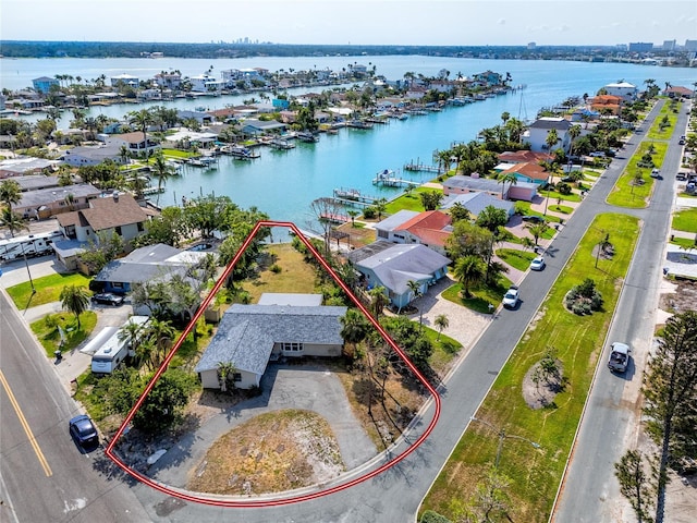 11465 7th St E, Treasure Island, FL 33706 - aerial perspective of suburban area with a large body of water and property boundaries highlighted