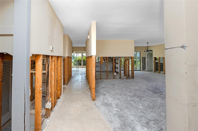 11465 7th St E, Treasure Island, FL 33706 - hall featuring tile patterned flooring