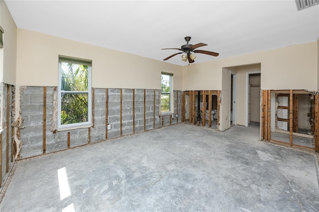 11465 7th St E, Treasure Island, FL 33706 - unfurnished living room featuring ceiling fan