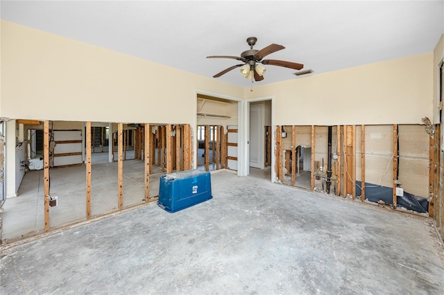 11465 7th St E, Treasure Island, FL 33706 - unfurnished living room featuring a ceiling fan