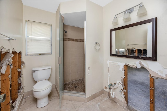 11465 7th St E, Treasure Island, FL 33706 - bathroom featuring a stall shower, toilet, baseboards, and tile patterned floors