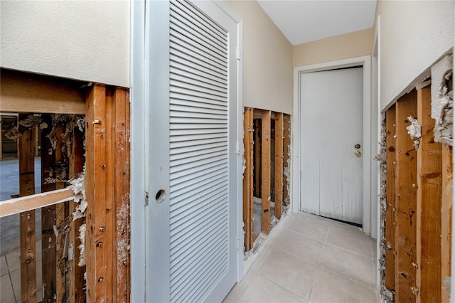 11465 7th St E, Treasure Island, FL 33706 - hallway with light tile patterned flooring