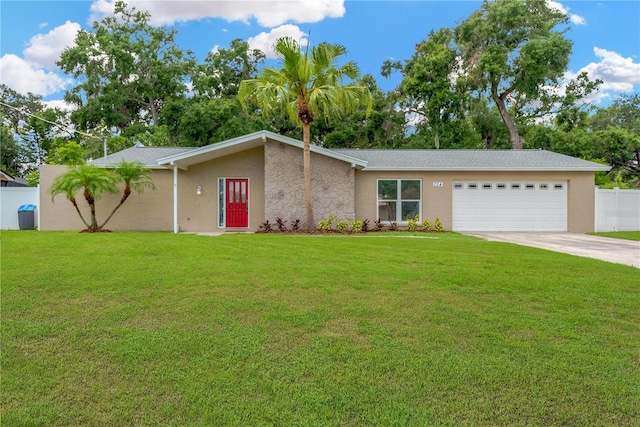 704 Childers Loop, Brandon, FL 33511 - view of front facade featuring concrete driveway, a garage, and stucco siding