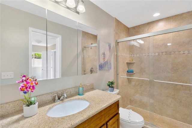 704 Childers Loop, Brandon, FL 33511 - bathroom featuring vanity, toilet, and a stall shower