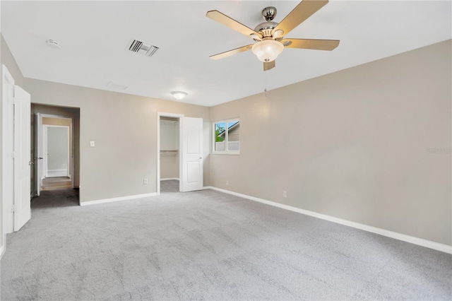 704 Childers Loop, Brandon, FL 33511 - unfurnished bedroom with baseboards, carpet floors, a spacious closet, and a ceiling fan