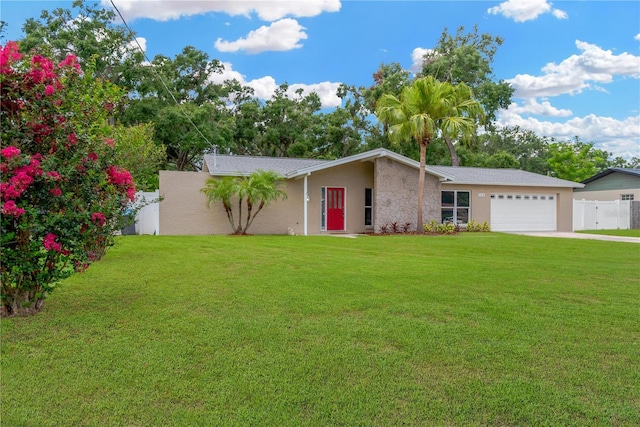 704 Childers Loop, Brandon, FL 33511 - view of front facade featuring stucco siding, an attached garage, and driveway