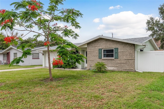 2020 Douglas Ave, Dunedin, FL 34698 - ranch-style home with a garage and driveway