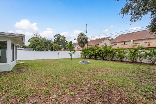 2020 Douglas Ave, Dunedin, FL 34698 - view of yard featuring an outdoor fire pit