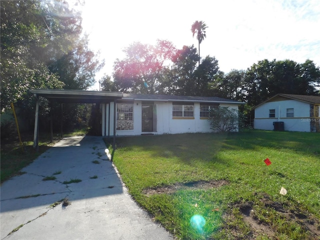 5707 S 79th St, Tampa, FL 33619 - ranch-style home featuring driveway, a front yard, and a carport