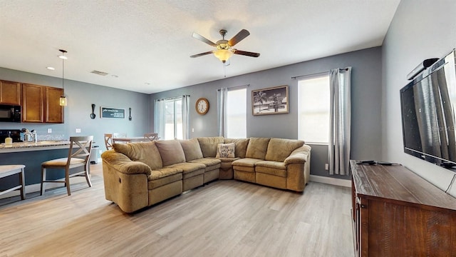 8111 Brickleton Woods Ave, Gibsonton, FL 33534 - living room featuring light wood-style floors, a ceiling fan, baseboards, and recessed lighting