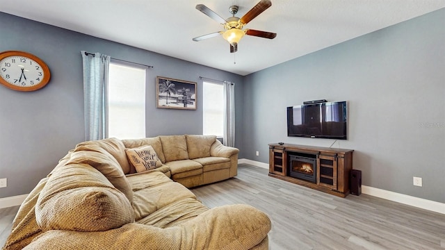8111 Brickleton Woods Ave, Gibsonton, FL 33534 - living room with ceiling fan, baseboards, and light wood finished floors
