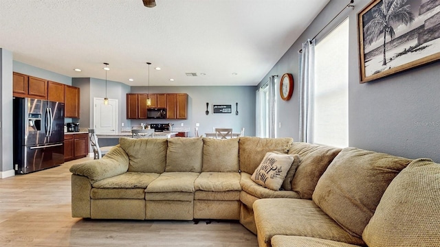 8111 Brickleton Woods Ave, Gibsonton, FL 33534 - living area with light wood-style floors and recessed lighting