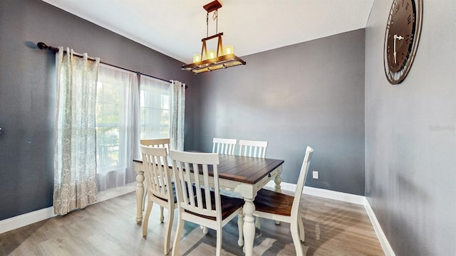 8111 Brickleton Woods Ave, Gibsonton, FL 33534 - dining room featuring wood finished floors and baseboards