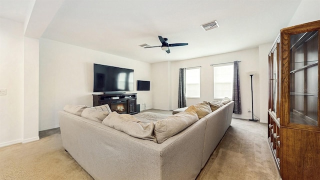 8111 Brickleton Woods Ave, Gibsonton, FL 33534 - living area featuring light colored carpet, a ceiling fan, and baseboards
