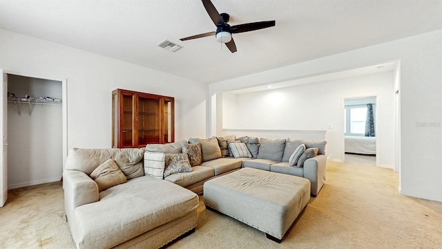 8111 Brickleton Woods Ave, Gibsonton, FL 33534 - living room featuring ceiling fan, light carpet, and baseboards