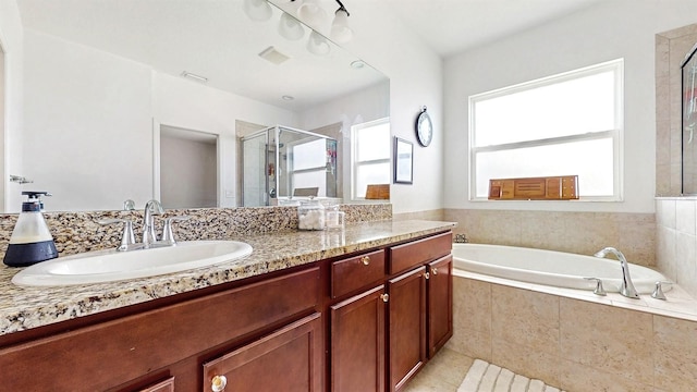 8111 Brickleton Woods Ave, Gibsonton, FL 33534 - bathroom with a stall shower, vanity, a garden tub, and tile patterned floors