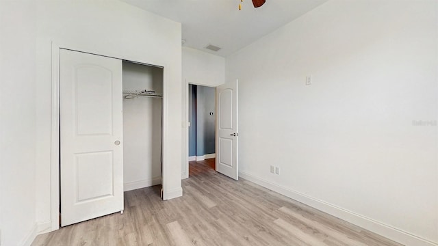 8111 Brickleton Woods Ave, Gibsonton, FL 33534 - unfurnished bedroom featuring light wood finished floors, a closet, baseboards, and ceiling fan