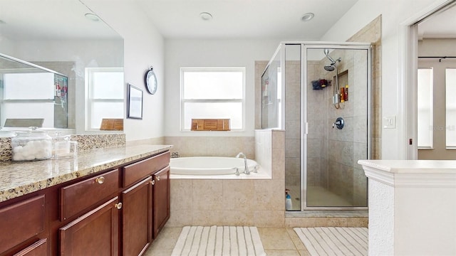 8111 Brickleton Woods Ave, Gibsonton, FL 33534 - full bath featuring tile patterned flooring, vanity, a garden tub, a stall shower, and recessed lighting