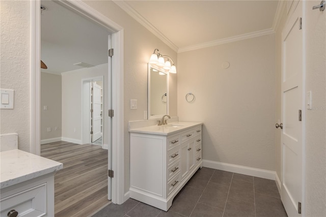 12 Bayou Ln, Palm Harbor, FL 34683 - bathroom featuring vanity, crown molding, and tile patterned flooring