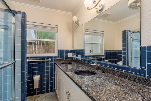 12 Bayou Ln, Palm Harbor, FL 34683 - bathroom featuring double vanity, a stall shower, crown molding, tile walls, and wainscoting