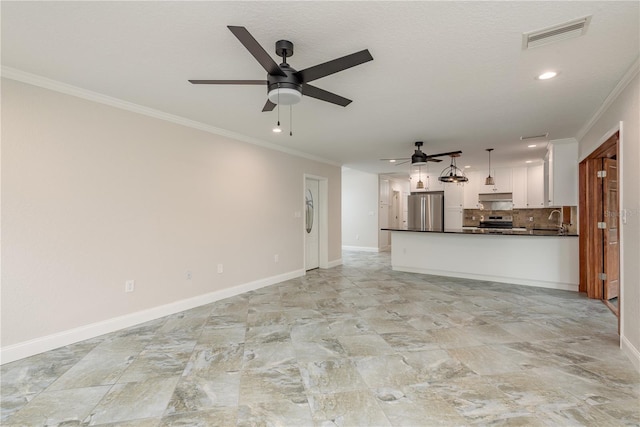 12 Bayou Ln, Palm Harbor, FL 34683 - unfurnished living room with a ceiling fan, ornamental molding, and recessed lighting
