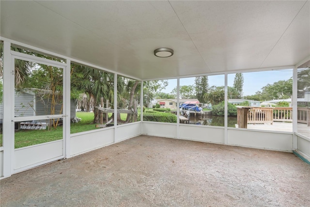 12 Bayou Ln, Palm Harbor, FL 34683 - unfurnished sunroom featuring a water view