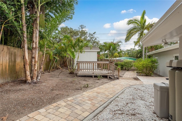 12 Bayou Ln, Palm Harbor, FL 34683 - view of yard with a wooden deck and a patio area