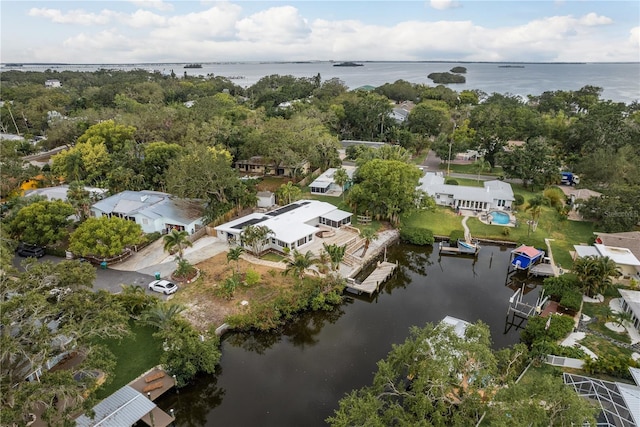 12 Bayou Ln, Palm Harbor, FL 34683 - aerial view of property and surrounding area featuring a nearby body of water and nearby suburban area