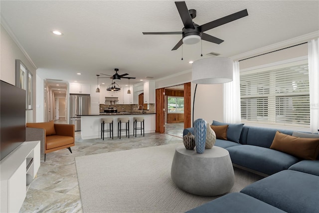 12 Bayou Ln, Palm Harbor, FL 34683 - living area with ceiling fan, crown molding, recessed lighting, and a textured ceiling