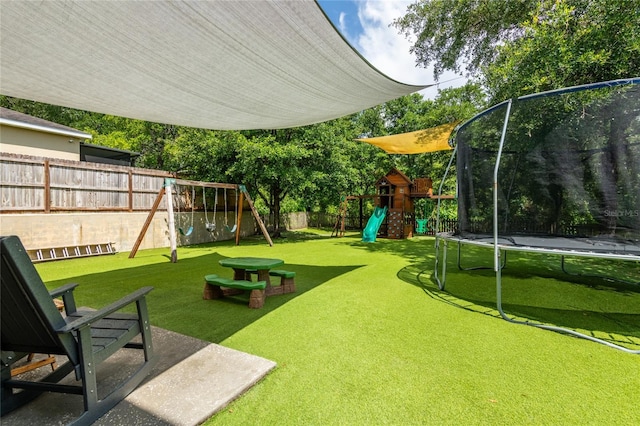 12208 Mcmullen Loop, Riverview, FL 33569 - view of yard featuring a trampoline and a playground