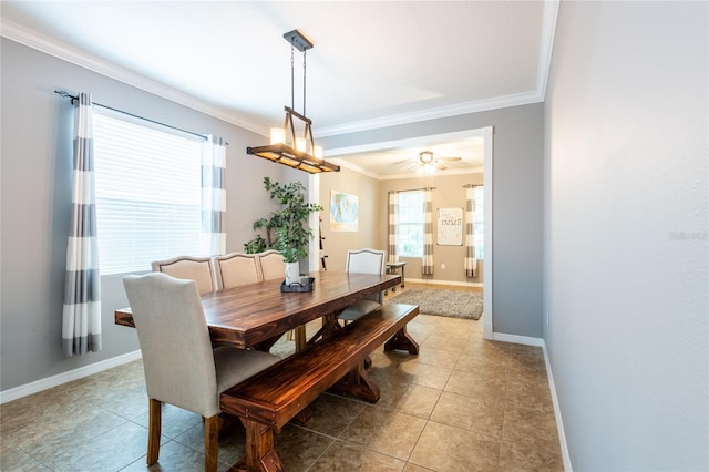 12208 Mcmullen Loop, Riverview, FL 33569 - dining room with ornamental molding, ceiling fan, baseboards, and light tile patterned floors