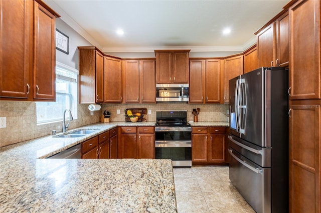 12208 Mcmullen Loop, Riverview, FL 33569 - kitchen with stainless steel appliances, a sink, brown cabinets, light stone counters, and decorative backsplash